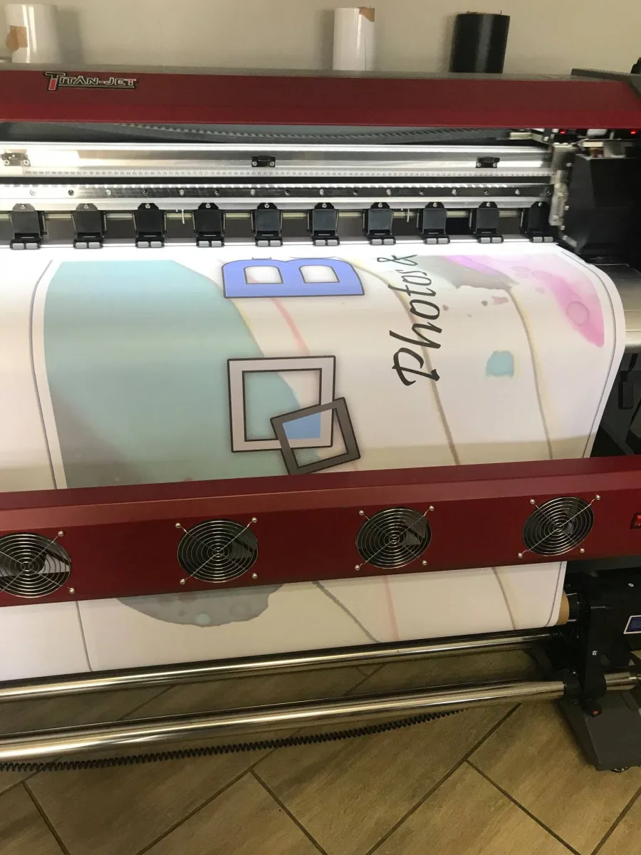 The printer printing the Basic Blue Photos and Framing banner